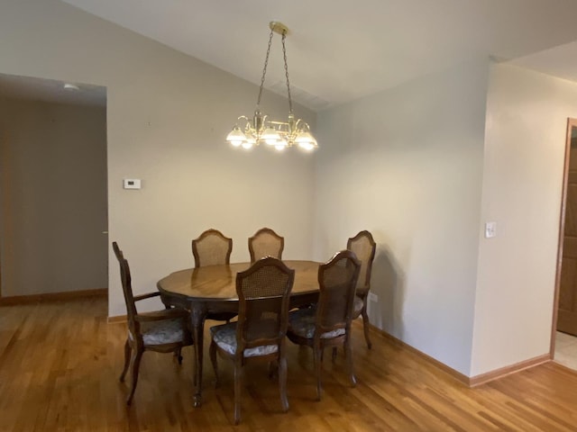 831 Oriole Dr, Peotone, IL 60468 - dining space featuring lofted ceiling, a chandelier, and light wood-type flooring