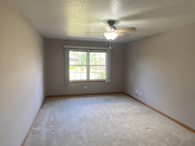 831 Oriole Dr, Peotone, IL 60468 - carpeted spare room featuring ceiling fan and a textured ceiling