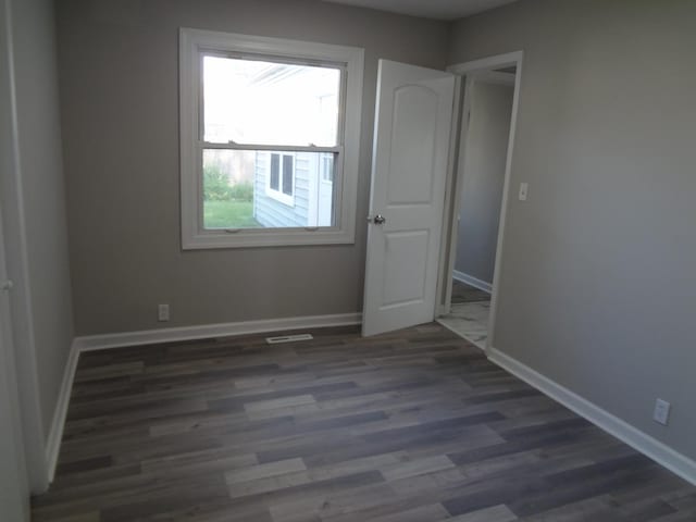 210 Caddy Ave, Carpentersville, IL 60110 - empty room with wood finished floors and baseboards
