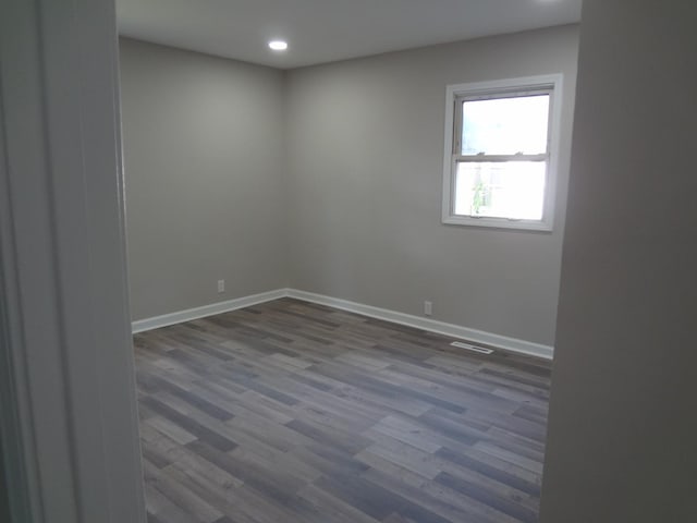 210 Caddy Ave, Carpentersville, IL 60110 - spare room featuring dark wood finished floors and recessed lighting