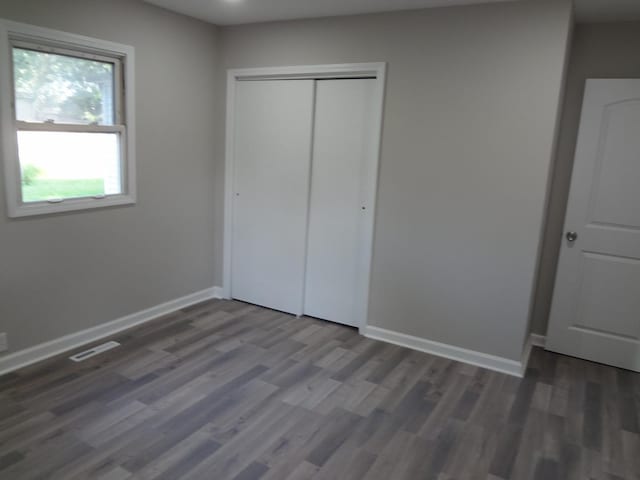 210 Caddy Ave, Carpentersville, IL 60110 - unfurnished bedroom with wood finished floors, a closet, and recessed lighting