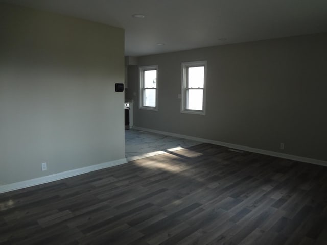 210 Caddy Ave, Carpentersville, IL 60110 - unfurnished room featuring baseboards and dark wood-type flooring