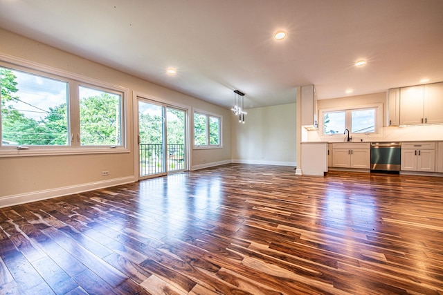 1665 Highland Blvd, Hoffman Estates, IL 60169 - unfurnished living room with a chandelier, dark wood-style floors, and recessed lighting