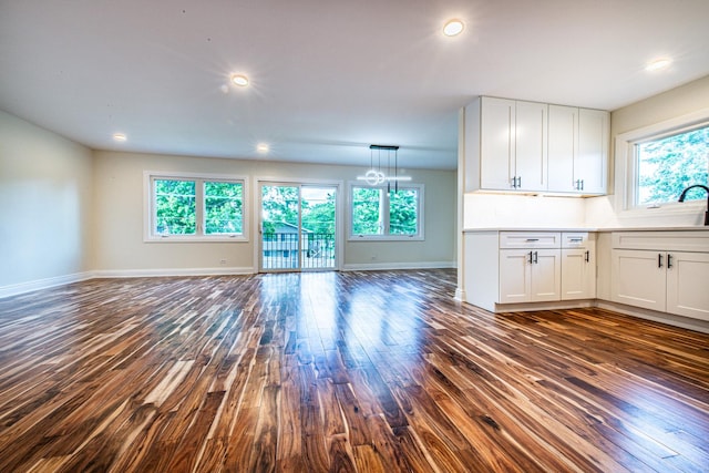 1665 Highland Blvd, Hoffman Estates, IL 60169 - unfurnished living room with dark wood-style flooring and recessed lighting