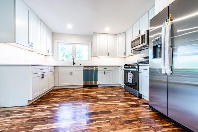 1665 Highland Blvd, Hoffman Estates, IL 60169 - kitchen with stainless steel appliances, dark wood finished floors, white cabinetry, light countertops, and recessed lighting