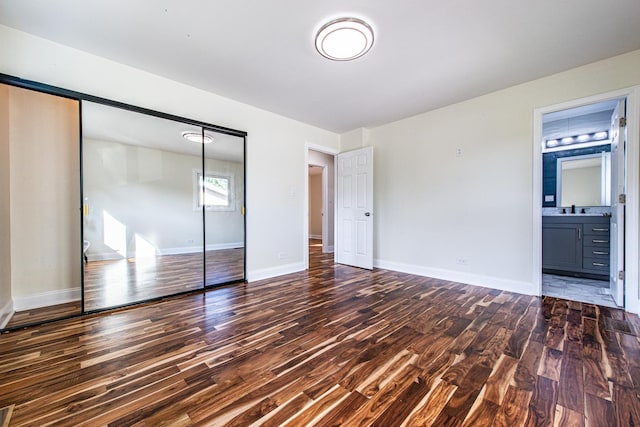 1665 Highland Blvd, Hoffman Estates, IL 60169 - unfurnished bedroom featuring wood finished floors, a closet, and connected bathroom