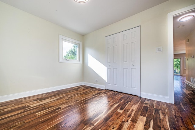 1665 Highland Blvd, Hoffman Estates, IL 60169 - unfurnished bedroom featuring wood finished floors and a closet