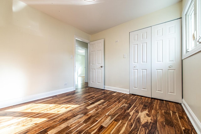 1665 Highland Blvd, Hoffman Estates, IL 60169 - unfurnished bedroom featuring dark wood finished floors and a closet