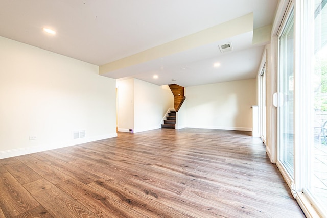 1665 Highland Blvd, Hoffman Estates, IL 60169 - empty room featuring stairs, wood finished floors, plenty of natural light, and recessed lighting