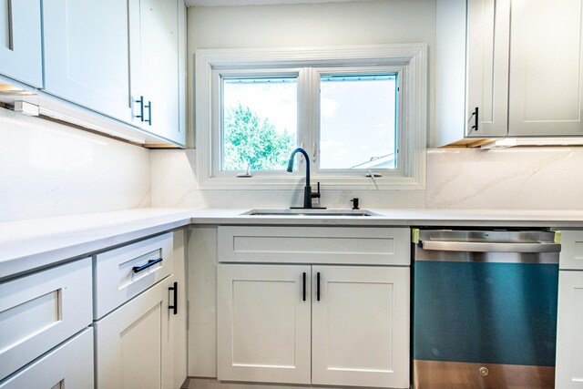 1665 Highland Blvd, Hoffman Estates, IL 60169 - kitchen featuring dishwashing machine, tasteful backsplash, and light countertops