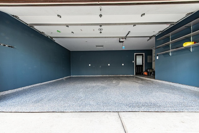 1665 Highland Blvd, Hoffman Estates, IL 60169 - garage with a garage door opener and baseboards