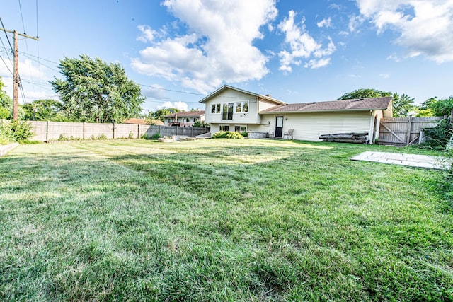 1665 Highland Blvd, Hoffman Estates, IL 60169 - rear view of house featuring a fenced backyard