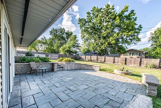 1665 Highland Blvd, Hoffman Estates, IL 60169 - fenced backyard with a patio and an outdoor fire pit