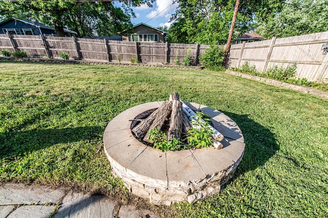 1665 Highland Blvd, Hoffman Estates, IL 60169 - fenced backyard with a fire pit