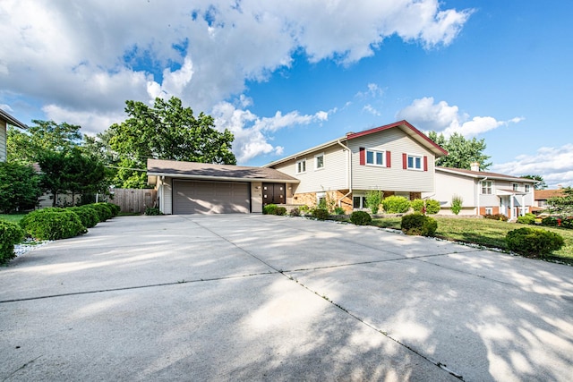 1665 Highland Blvd, Hoffman Estates, IL 60169 - tri-level home featuring concrete driveway and a garage