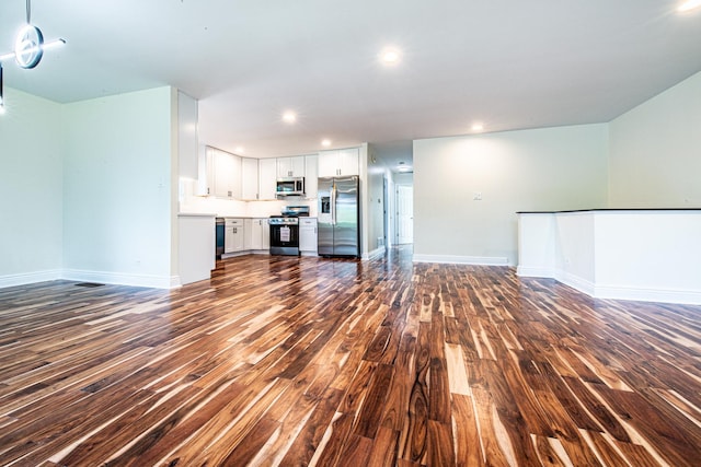 1665 Highland Blvd, Hoffman Estates, IL 60169 - unfurnished living room with dark wood-type flooring and recessed lighting