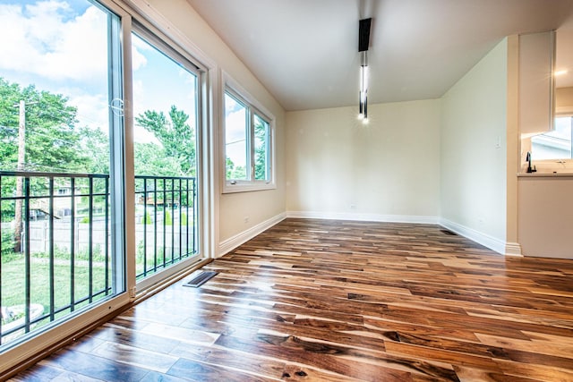 1665 Highland Blvd, Hoffman Estates, IL 60169 - empty room featuring dark wood-style floors and baseboards