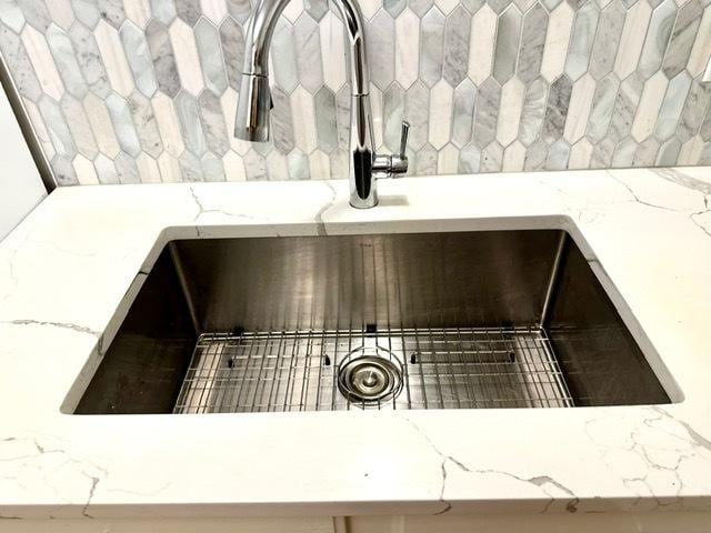 2317 N Neva Ave Unit 106A, Chicago, IL 60707 - kitchen view of backsplash and light stone countertops