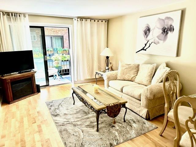 2317 N Neva Ave Unit 106A, Chicago, IL 60707 - living room with wood finished floors
