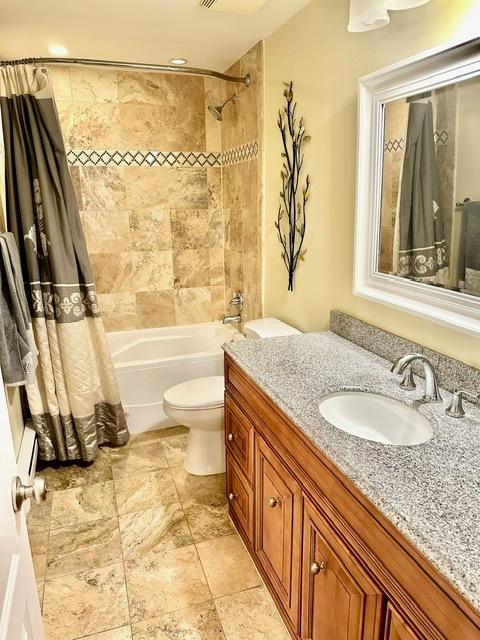 2317 N Neva Ave Unit 106A, Chicago, IL 60707 - full bathroom with vanity and shower / bath combo with shower curtain
