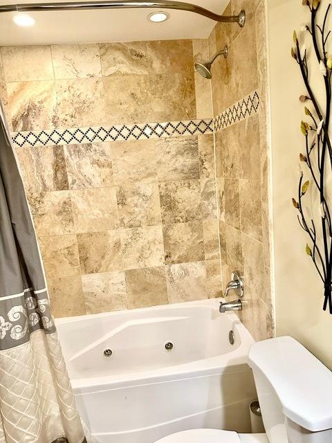 2317 N Neva Ave Unit 106A, Chicago, IL 60707 - bathroom with shower / bathtub combination with curtain and recessed lighting