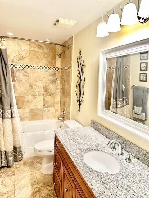 2317 N Neva Ave Unit 106A, Chicago, IL 60707 - bathroom featuring vanity and shower / bath combo with shower curtain