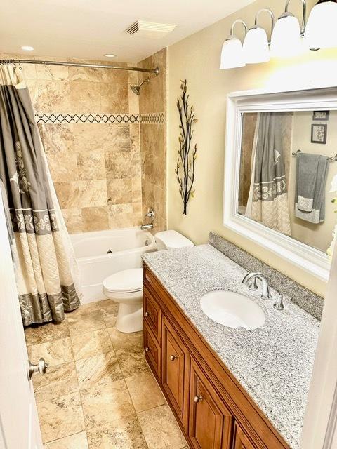 2317 N Neva Ave Unit 106A, Chicago, IL 60707 - full bathroom with vanity and shower / bath combo with shower curtain