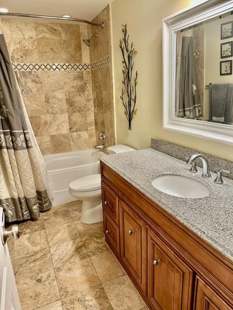 2317 N Neva Ave Unit 106A, Chicago, IL 60707 - bathroom with vanity and shower / bathtub combination with curtain