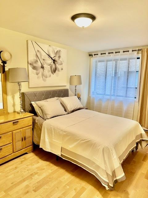 2317 N Neva Ave Unit 106A, Chicago, IL 60707 - bedroom featuring light wood-type flooring