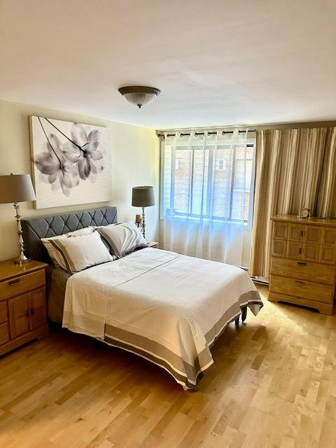 2317 N Neva Ave Unit 106A, Chicago, IL 60707 - bedroom featuring light wood-type flooring