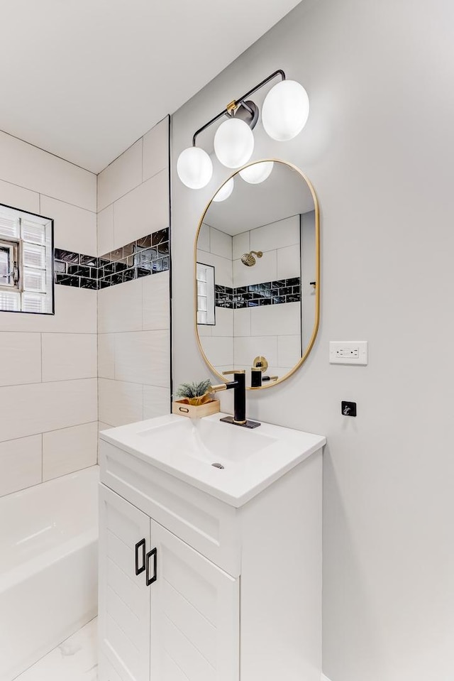 8109 S Marquette Ave, Chicago, IL 60617 - full bath featuring vanity, marble finish floors, and washtub / shower combination