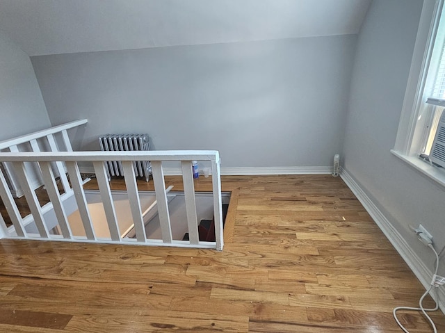 14931 Riverside Dr, South Holland, IL 60473 - stairs featuring radiator heating unit, wood finished floors, and lofted ceiling