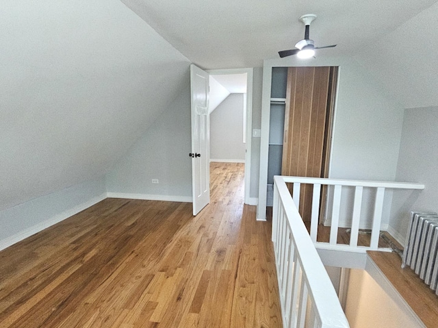 14931 Riverside Dr, South Holland, IL 60473 - bonus room featuring wood finished floors, vaulted ceiling, and ceiling fan