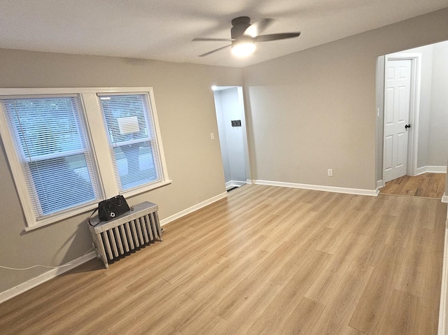 14931 Riverside Dr, South Holland, IL 60473 - spare room featuring a ceiling fan and light wood-style flooring