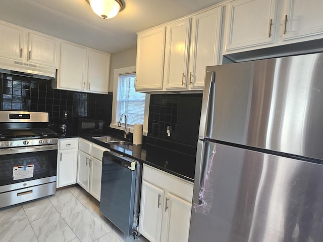 14931 Riverside Dr, South Holland, IL 60473 - kitchen with appliances with stainless steel finishes, under cabinet range hood, white cabinets, and dark countertops