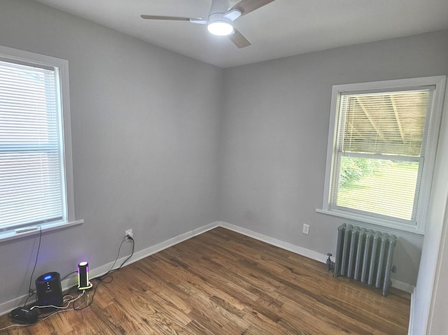 14931 Riverside Dr, South Holland, IL 60473 - empty room featuring radiator, dark wood-type flooring, plenty of natural light, and ceiling fan