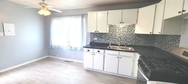 9236 Stanford Dr S, Bridgeview, IL 60455 - kitchen with stainless steel stove, tasteful backsplash, a ceiling fan, and light wood-type flooring