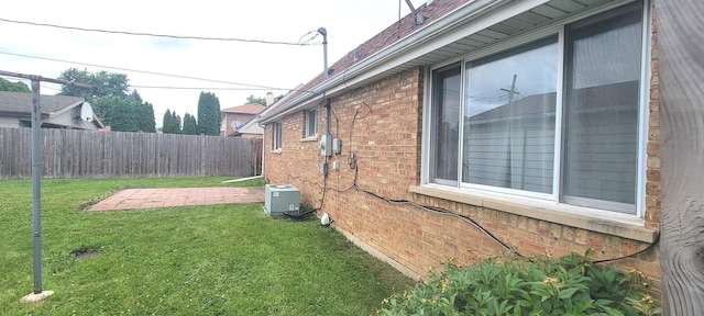 9236 Stanford Dr S, Bridgeview, IL 60455 - view of home's exterior with a fenced backyard, brick siding, and a patio