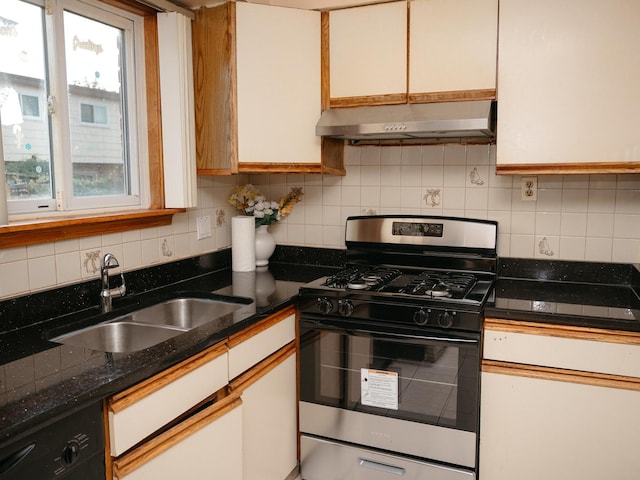 9404 Hamlin Ave, Des Plaines, IL 60016 - kitchen with gas range oven, under cabinet range hood, black dishwasher, decorative backsplash, and white cabinets