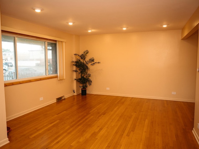 9404 Hamlin Ave, Des Plaines, IL 60016 - spare room featuring wood finished floors and recessed lighting