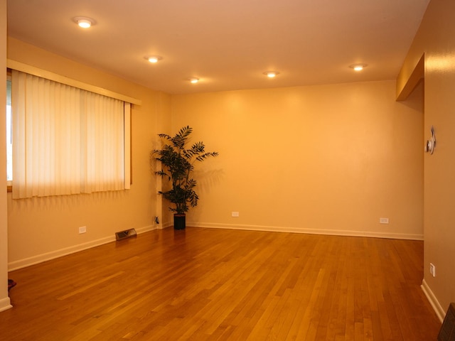 9404 Hamlin Ave, Des Plaines, IL 60016 - empty room featuring wood finished floors and baseboards