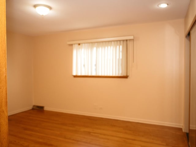 9404 Hamlin Ave, Des Plaines, IL 60016 - spare room with wood finished floors and baseboards