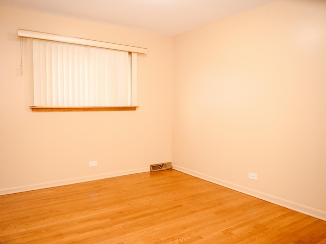 9404 Hamlin Ave, Des Plaines, IL 60016 - spare room with light wood-style floors and baseboards