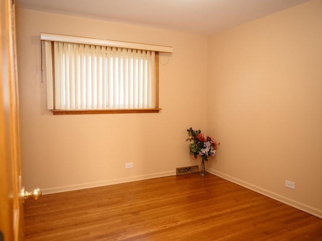 9404 Hamlin Ave, Des Plaines, IL 60016 - unfurnished room featuring wood finished floors and baseboards