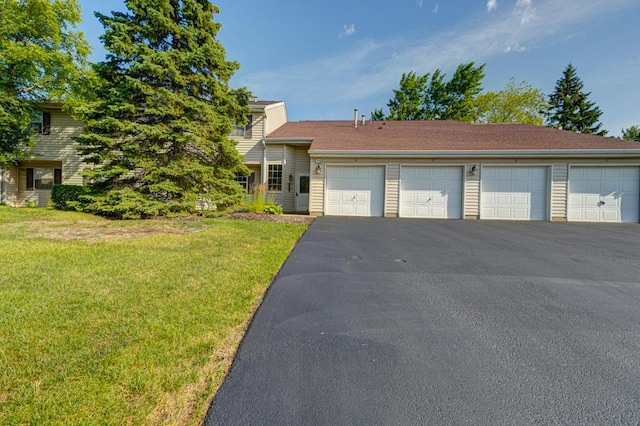 556 E Shagbark Ln Unit C, Streamwood, IL 60107 - view of front of property featuring a front yard and community garages