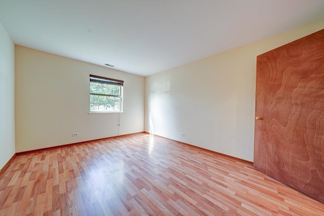 556 E Shagbark Ln Unit C, Streamwood, IL 60107 - unfurnished room with light wood-style flooring