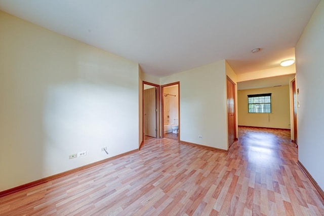 556 E Shagbark Ln Unit C, Streamwood, IL 60107 - unfurnished room with light wood-style flooring and baseboards