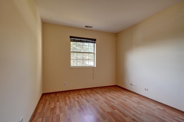 556 E Shagbark Ln Unit C, Streamwood, IL 60107 - empty room with light wood finished floors and baseboards