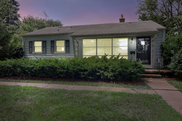 950 Pennsylvania Ave, Aurora, IL 60506 - view of front of home featuring a chimney and a front lawn