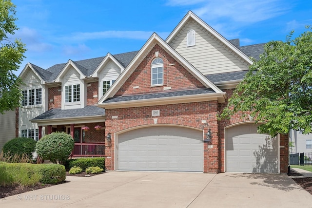 12840 Shenandoah Trl, Plainfield, IL 60585 - view of front of house with driveway, brick siding, roof with shingles, and covered porch